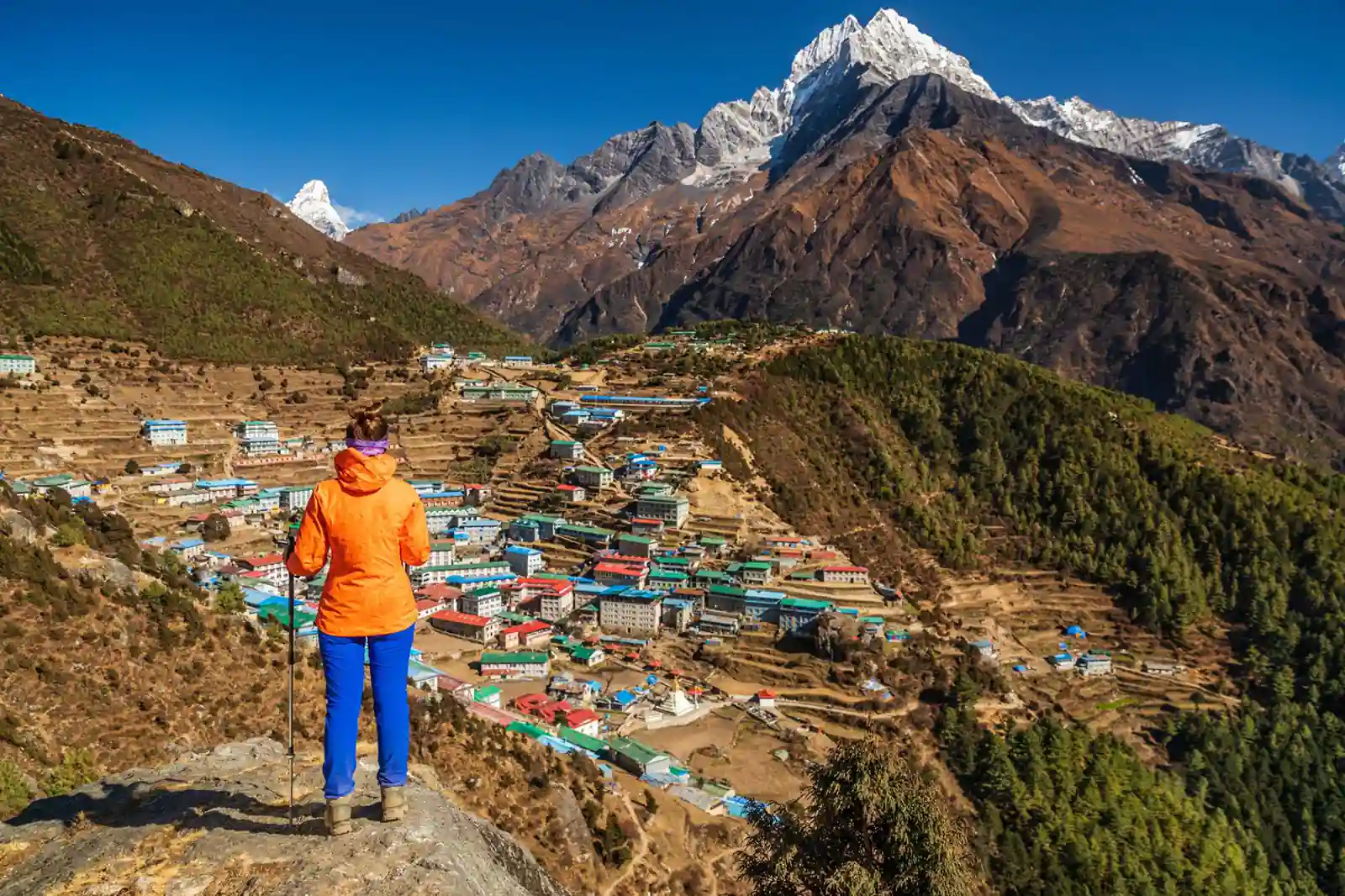 Woman looking at Namche Bazaar from above