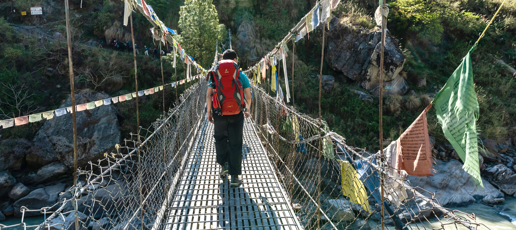 Crossing the suspension bridge during Langtang Valley Trek