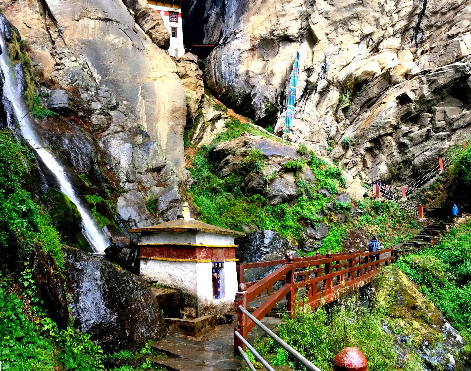 A small waterfalls and prayer wheel temple near Paro Taktsang, Bhutan.