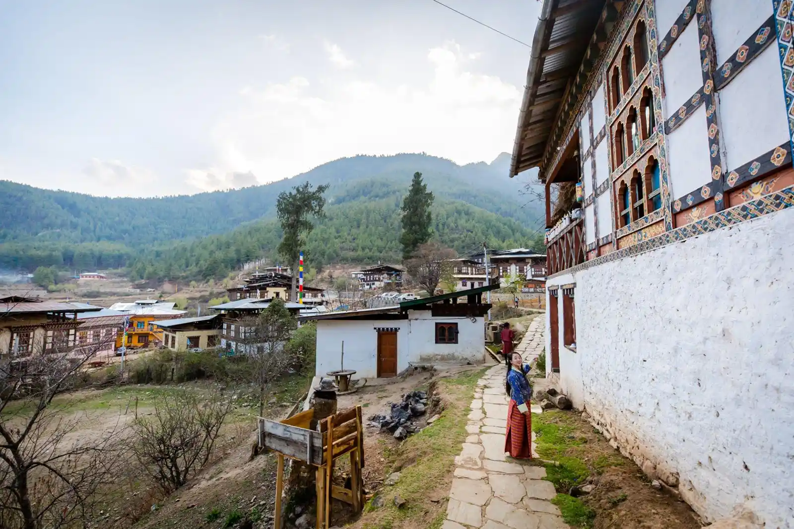 A tourist and local guide explore Drukgyal Dzong, a captivating fortress and Buddhist monastery