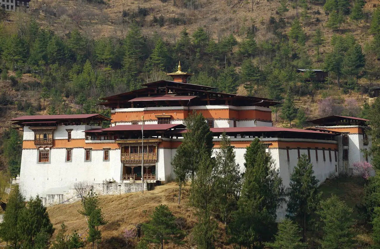 Chagri or Cheri Monastery in Thimphu Valley, Bhutan, built in 1620, surrounded by forested hills.