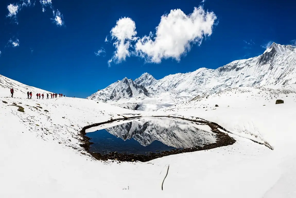 A Himalayan mirror at an altitude of 5000m under the perpetually frozen Annapurna's gaze. In this reflection, Gangapurna (7455m) can be seen, while Khangsar Kang (7485m) stands on the right.