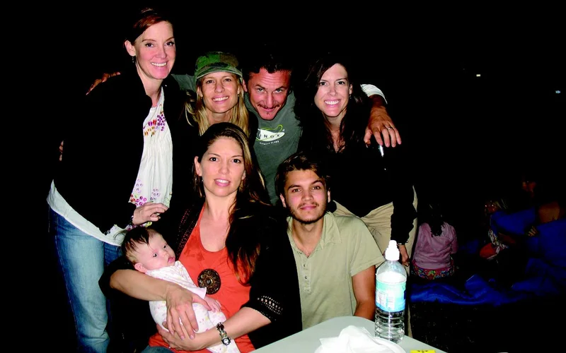 (Clockwise from bottom left) Carine McCandless and her daughter Christiana, Shelly McCandless, Robin Wright, Sean Penn, Shawna McCandless, and Emile Hirsch on the South Dakota movie set of Into the Wild in the summer of 2006. (Carine McCandless Family Collection)
