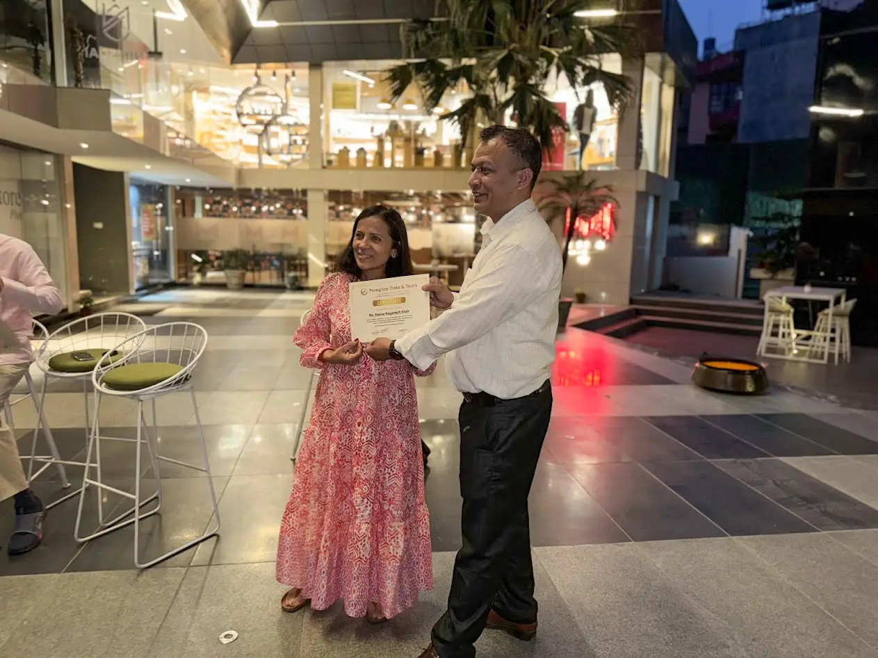 Peregrine Treks chairman presenting the Everest Base Camp trek completion certificate to a client at the Kathmandu Marriott Hotel
