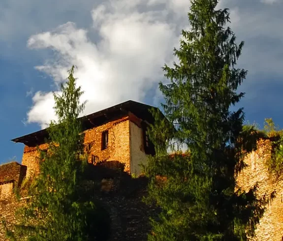 Ruins of Drukgyel Dzong in Bhutan surrounded by lush greenery