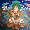 Colorful mural of Padmasambhava (Guru Rinpoche) depicted on the wall of Taktsang Lakhang Monastery in Paro, Bhutan.