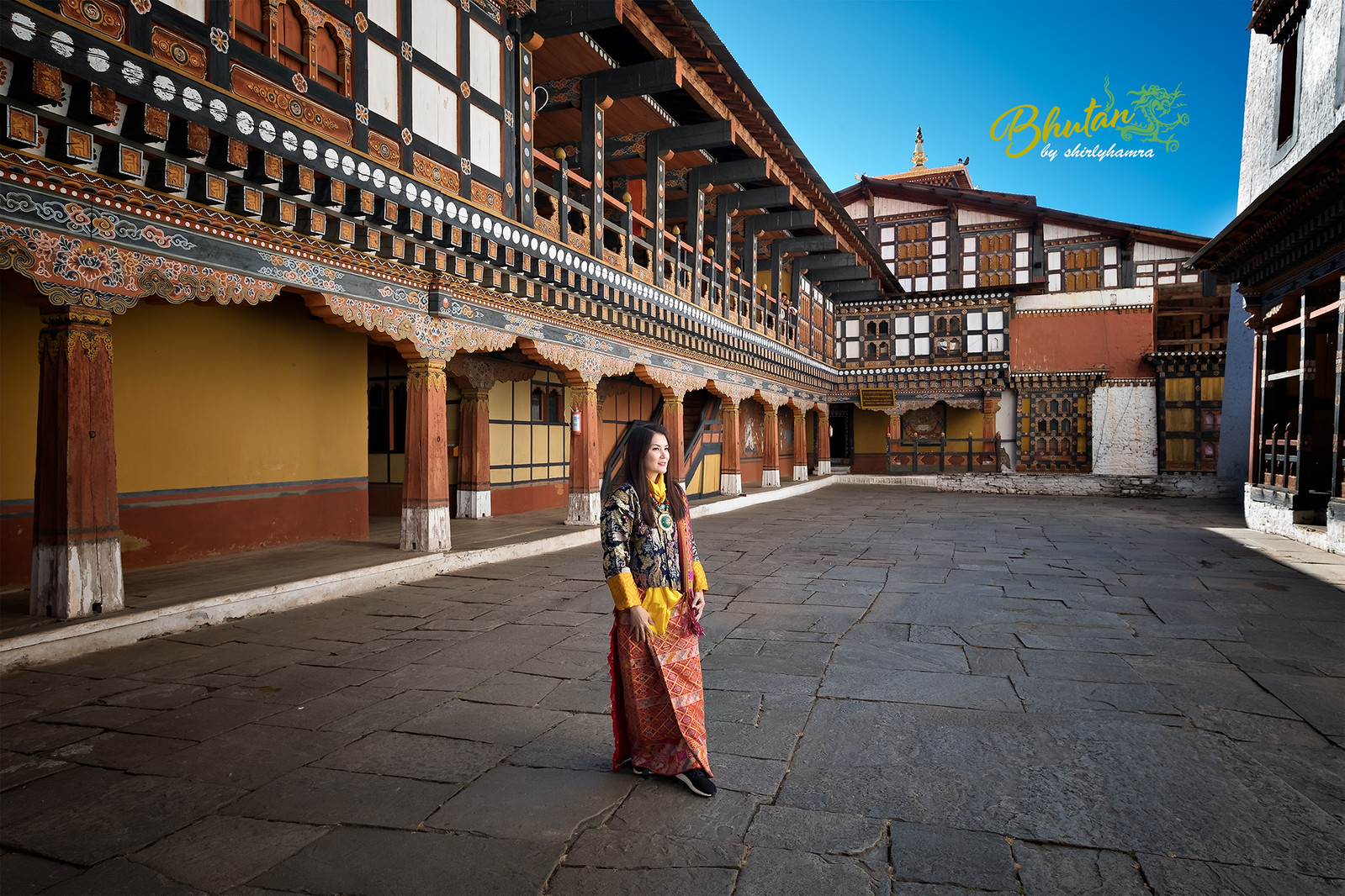 Woman standing in the courtyard of Ta Dzong, the National Museum of Bhutan
