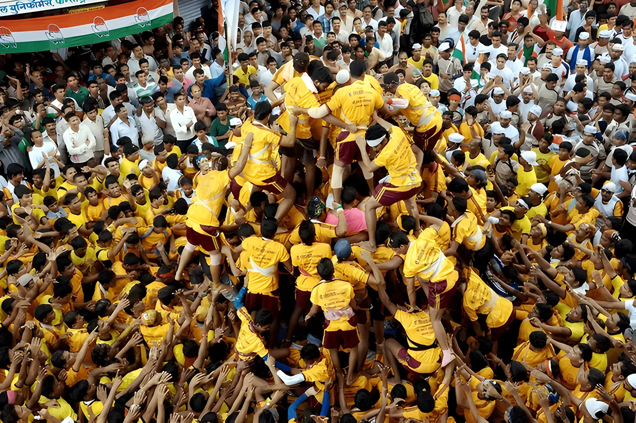 Human pyramid attempts to break a Dahi Handi during Janmashtami celebrations in India.