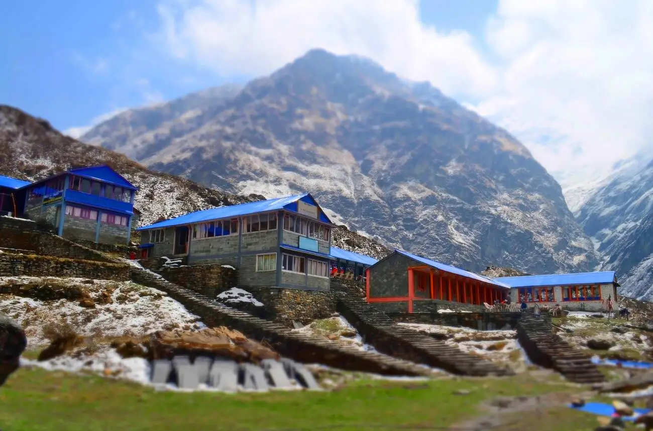 Lodge for trekkers at Machapuchare Base Camp with the Himalayan mountains in the background.