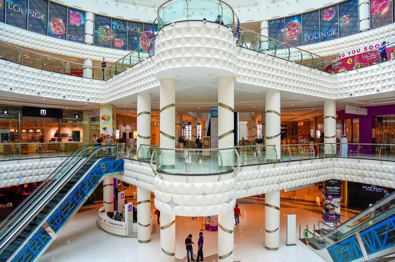 Inside view of the Oman Avenues Mall in Muscat, showcasing its modern architecture with multiple levels and decorative interiors.