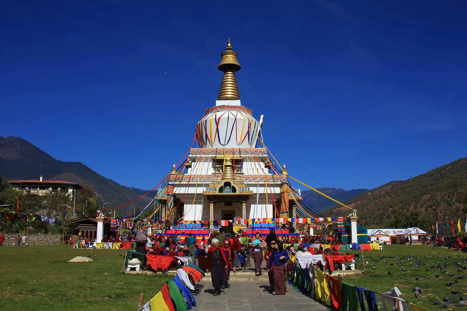 National Memorial Chorten Thimphu Bhutan with prayer flags and local worshippers