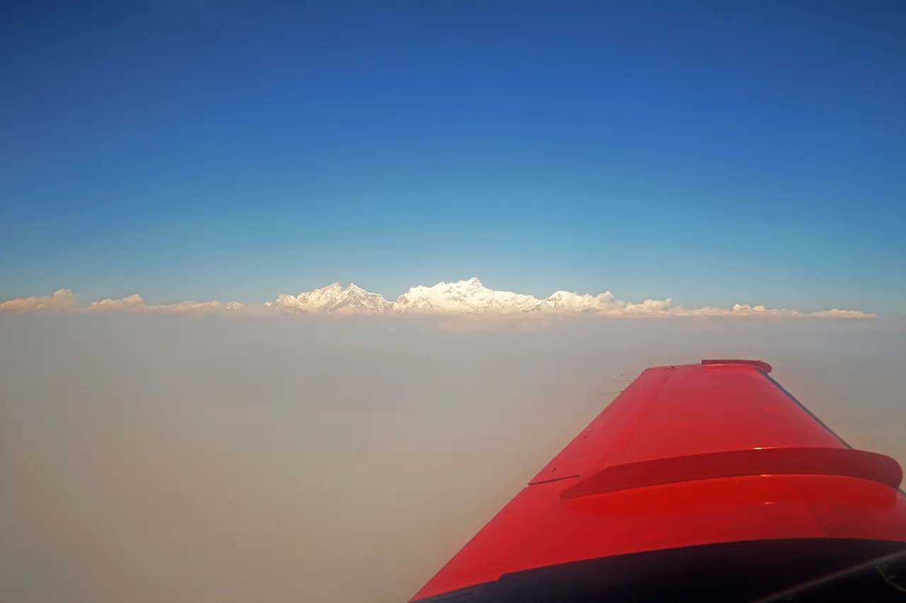 View of Mount Everest and the Himalayas from an airplane window