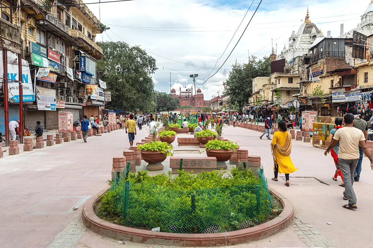 Redeveloped street view of Chandni Chowk with Red Fort in the background