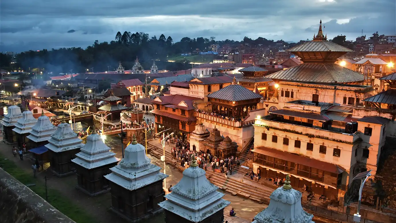 Pashupatinath Temple complex at dusk along the Bagmati River in Kathmandu
