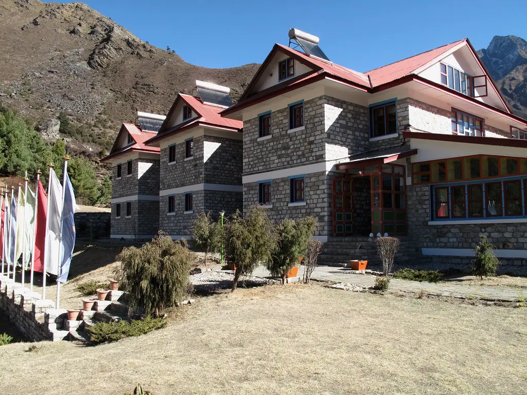 Everest Summit Lodge with stone buildings and red roofs in the Everest region