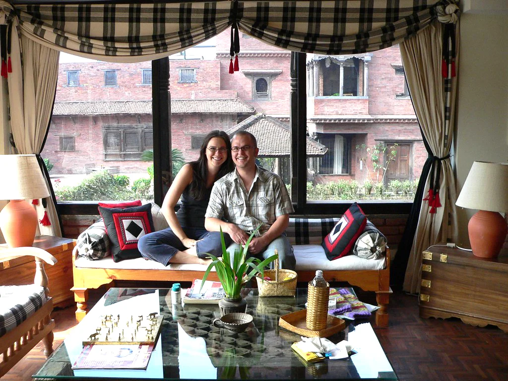 Couple relaxing at Dwarika’s Hotel in Kathmandu during a luxury Nepal tour, enjoying heritage architecture, private comfort, and a refined stay.