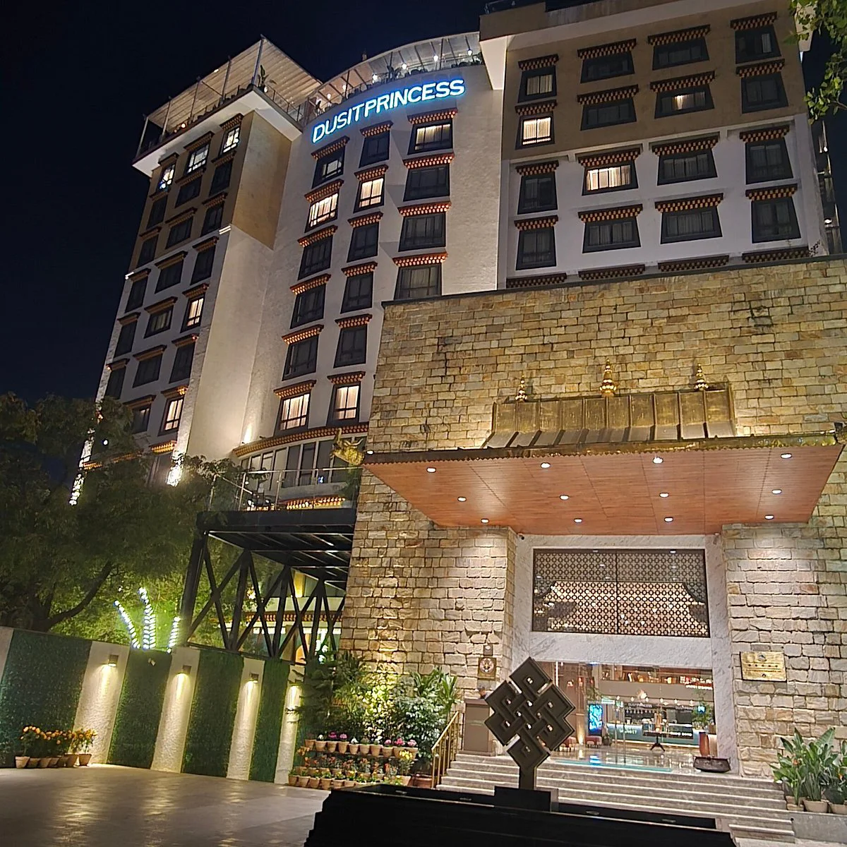 Best 5-Star Hotels in Kathmandu featuring Dusit Princess Kathmandu at night with a modern illuminated façade, elegant entrance, and upscale city-hotel atmosphere