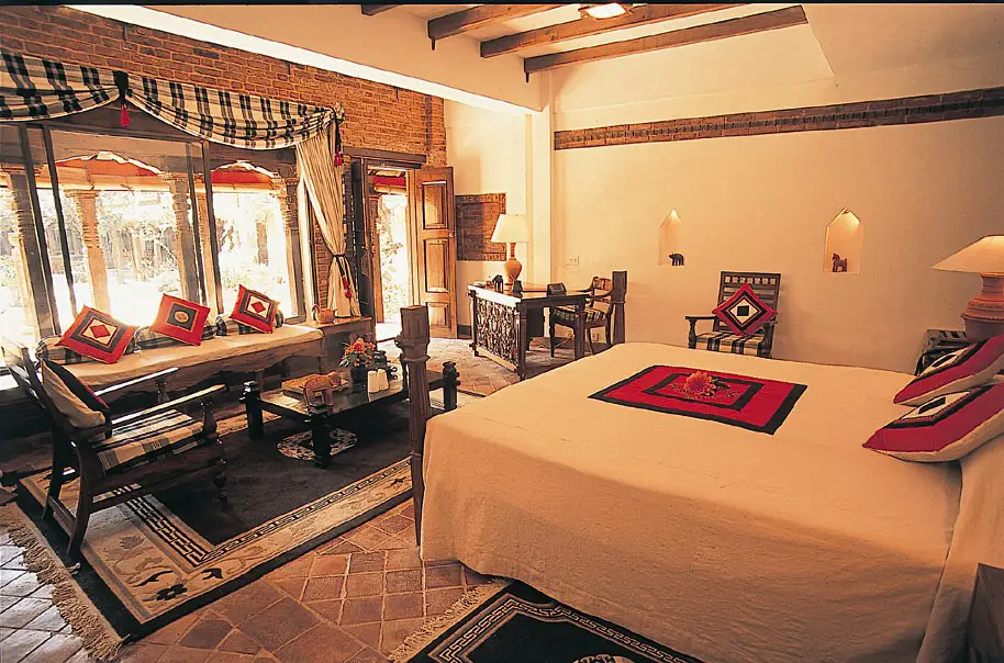 Elegant heritage hotel room featured in a Luxury Nepal Tour Cost experience, with warm interiors, traditional décor, and a premium comfort setting.