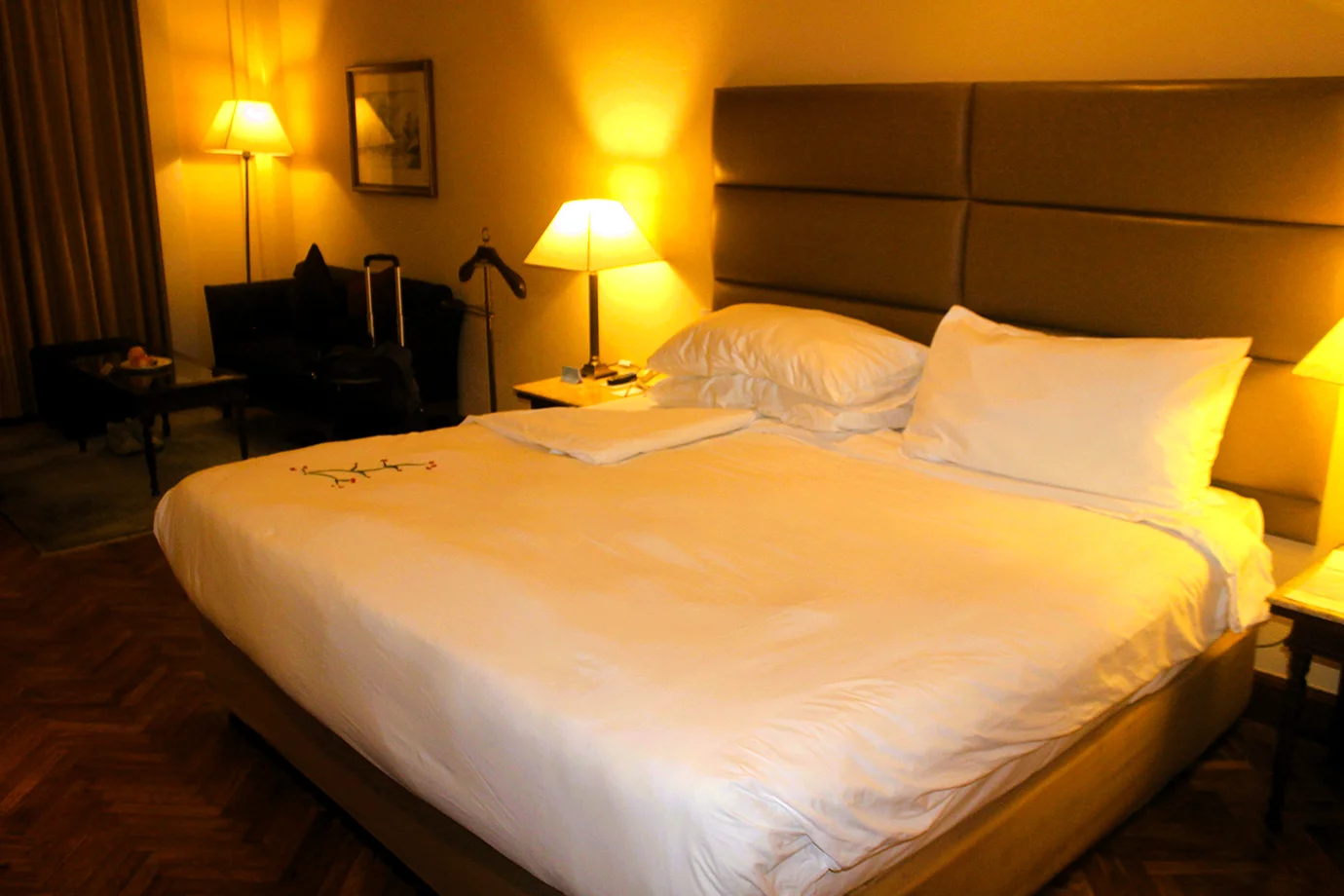 Luxury hotel suite in Nepal during the Best Time for a Luxury Nepal Tour, featuring elegant bedding, warm lighting, and premium comfort amenities.