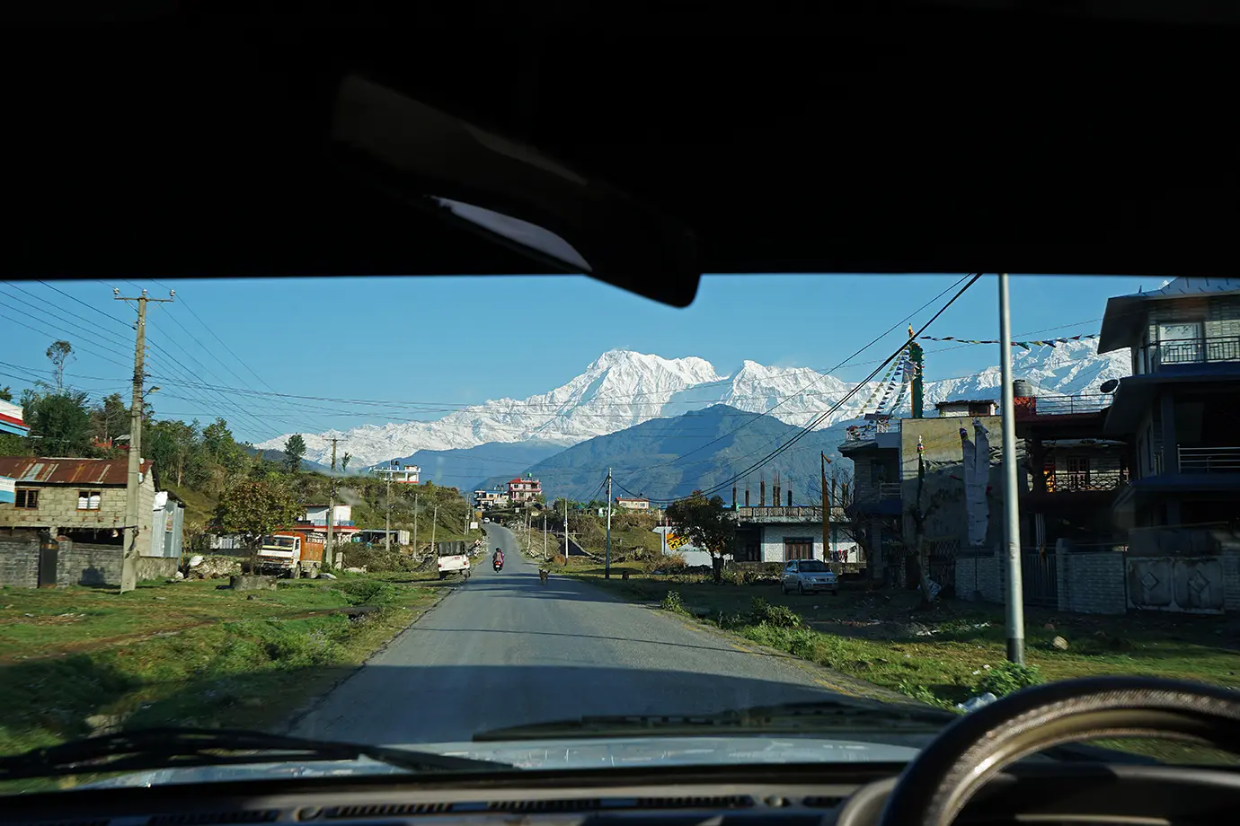 Scenic road to Pokhara Nepal with mountain view and local village along highway