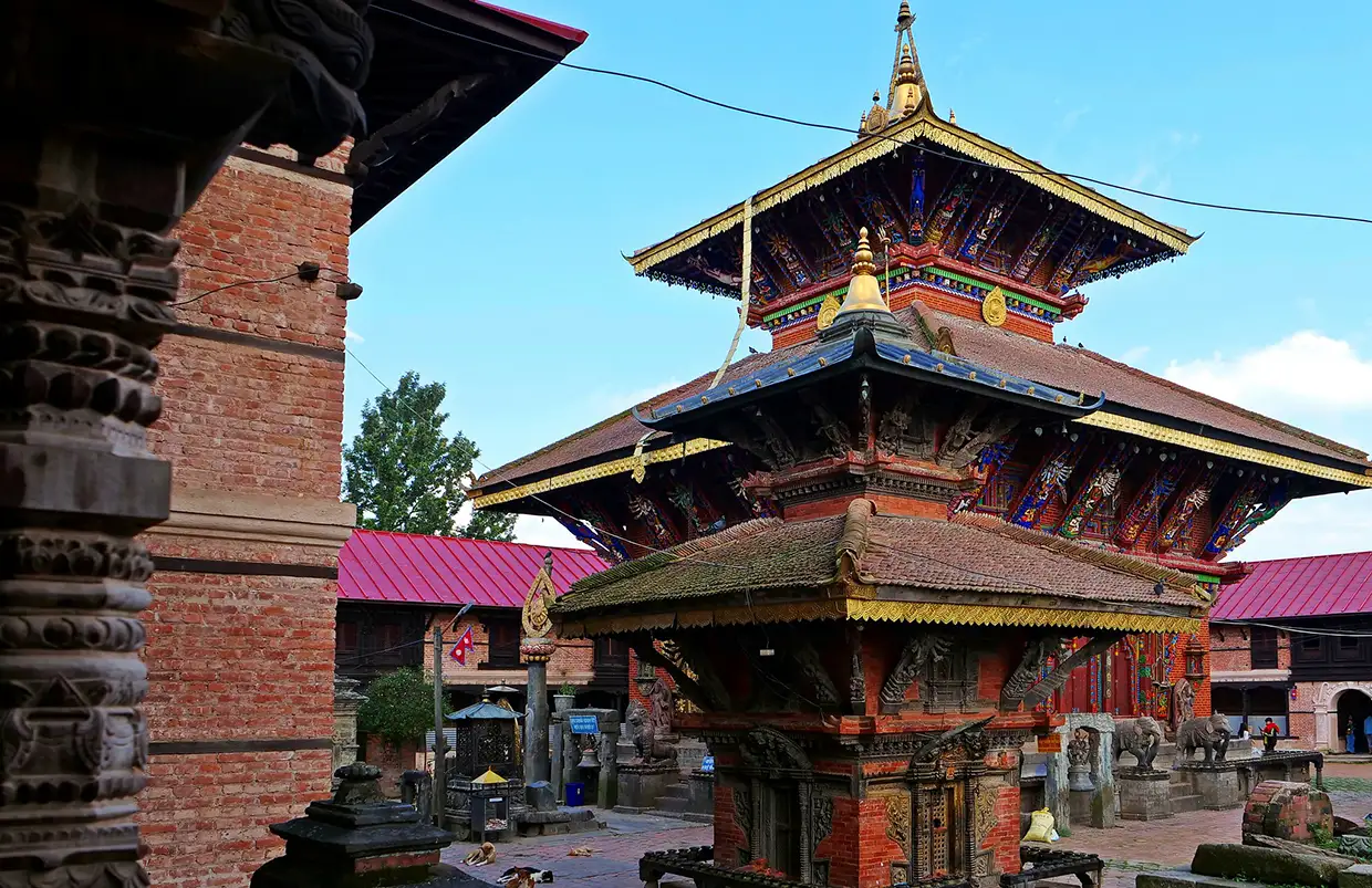 The ancient wood and brick architecture of changu narayan temple stands under a clear sky, offering a historic highlight for your Kathmandu Luxury Experience.