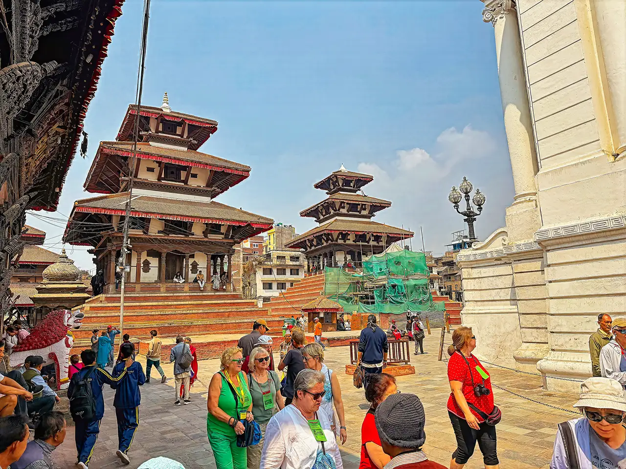 Tourists visit Kathmandu Durbar Square, where traditional pagoda temples, historic courtyards, and local heritage sites showcase Nepal’s rich culture.