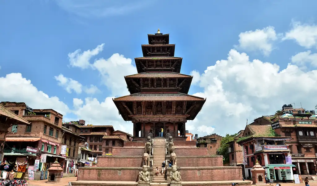 The five-story Nyatapol Temple stands tall in Bhaktapur Durbar Square, a magnificent architectural stop on your Luxury Kathmandu Pokhara Chitwan Tour.