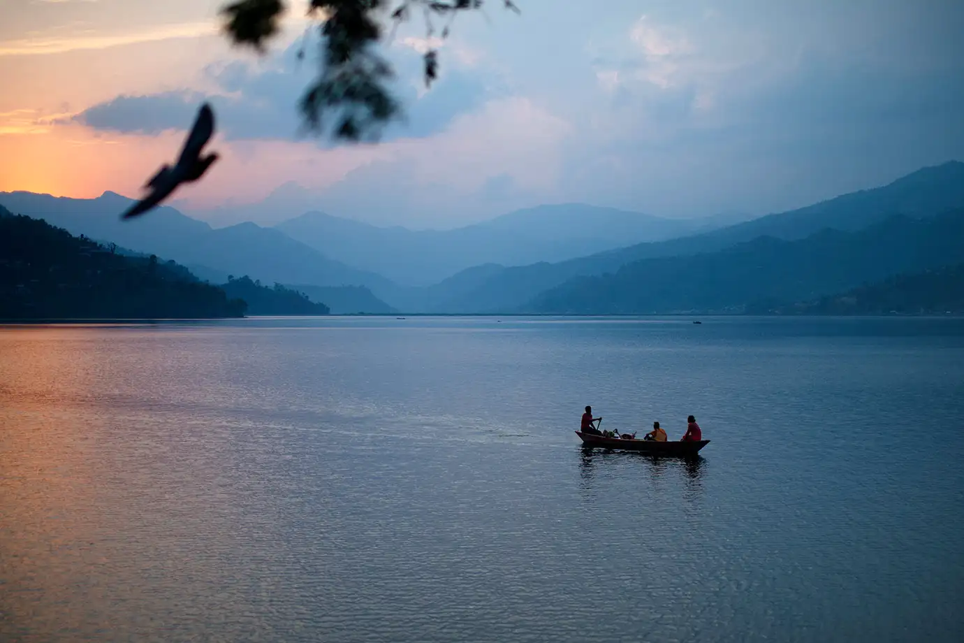A serene sunset over a lake, emphasizing relaxation.