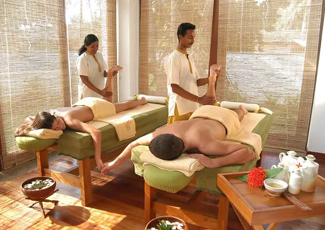 Ayurveda in Sri Lanka is showcased as guests receive traditional herbal treatments from practitioners at a doctor-led wellness retreat.