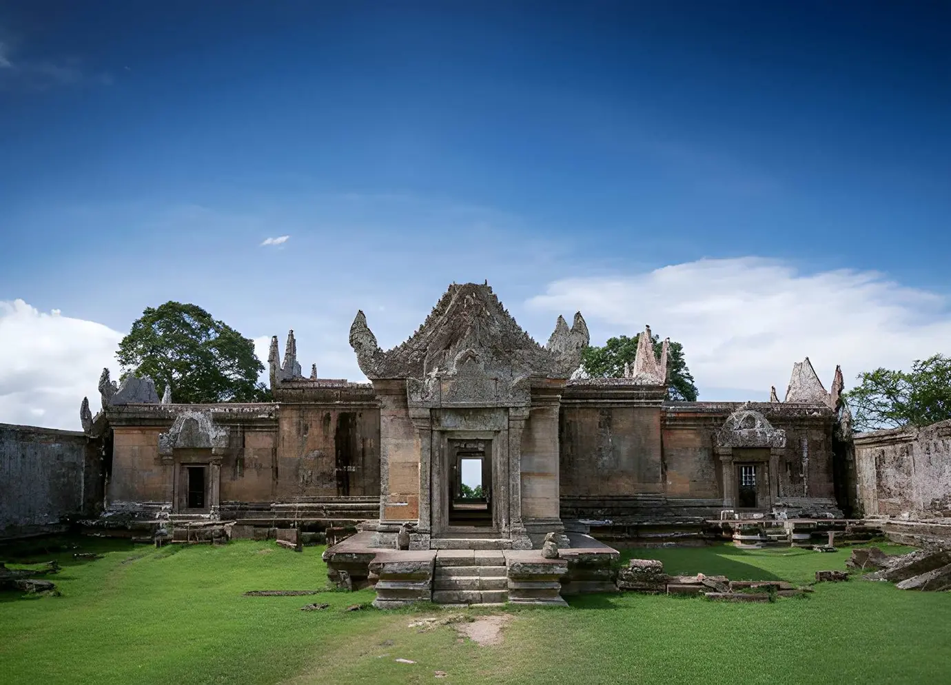 The stone central gateway and courtyard of Preah Vihear Temple under a clear blue sky featured in a travel guide on Is Cambodia Safe.