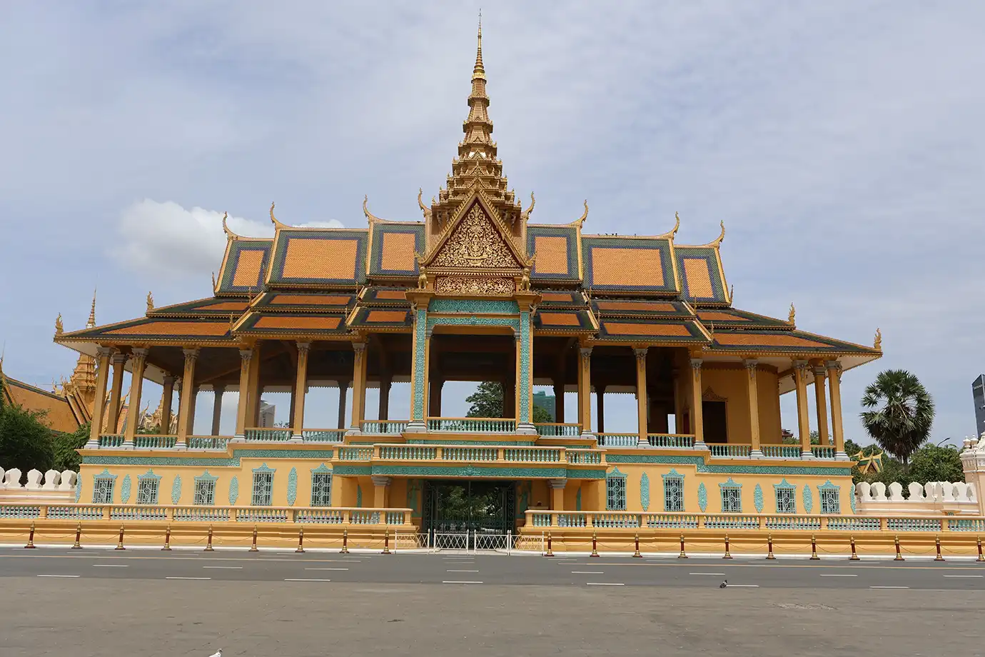The golden multi-tiered roof and intricate Khmer architecture of the Royal Palace complex featured in a travel guide on Cambodia Itinerary.
